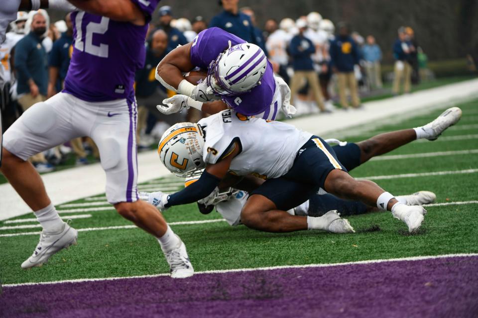 Furman's Tyler Huff (6) is tackled during the second round of FSC playoffs against Chattanooga at Paladin Stadium in Greenville, SC, on Saturday, Dec. 2, 2023.