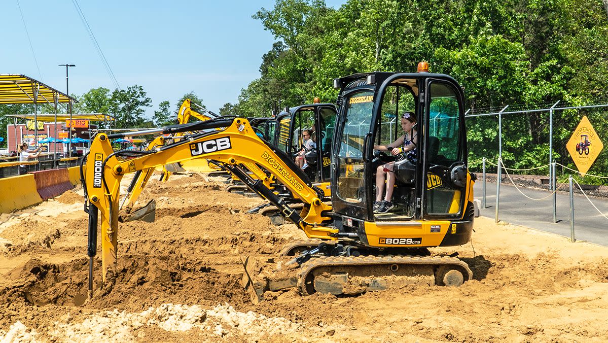 A young guest operates machinery at Diggerland USA.