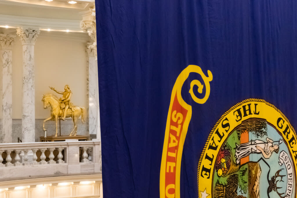 state flag hangs in the rotunda at the Idaho State Capitol building