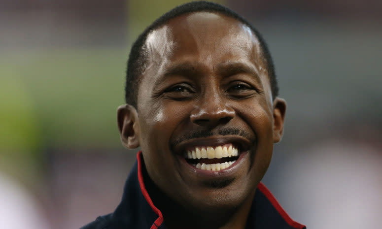 desmond howard smiles on the field before a game against alabama