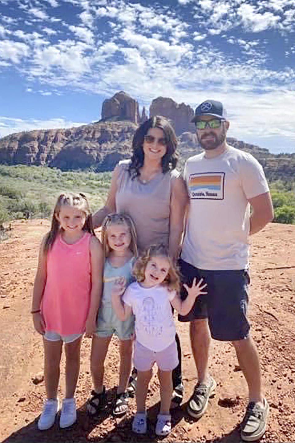 In this undated photo provided by Sandra Hooker, the Rackley family poses for a picture while on a trip to Sedona, Arizona. From left are, Annistyn, 9, Avalinn, 7, Alanna, 3, and their parents, Megan and Trey. Annistyn, who loved swimming, dancing and cheerleading, was among dozens of people who died because of a severe storm, Friday, Dec. 10, 2021. A tornado hit her home and splintered it less than a week after the family had moved in. (Summer Alexander/Courtesy of Sandra Hooker via AP)