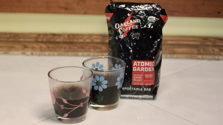 Black Oakland Coffee bag with two glasses