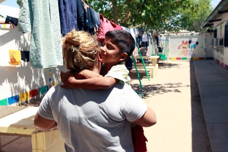 Honduran migrant Denia Carranza, 24, and her son Robert, 7, who have given up their U.S. asylum claim under the Migrant Protection Protocol (MPP), are seen at Casa del Migrante migrant shelter, in Ciudad Juarez