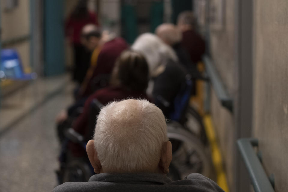 FILE - In this Saturday, Jan. 2, 2021 file photo elderly people wait for the COVID-19 vaccine at the Don Orione rest home in Rome. In some Italian region lawyers, magistrates, professors and other younger professionals got vaccinated against COVID-19 before octogenarians despite government pledges of prioritizing Italy’s oldest citizens. (AP Photo/Alessandra Tarantino, file)