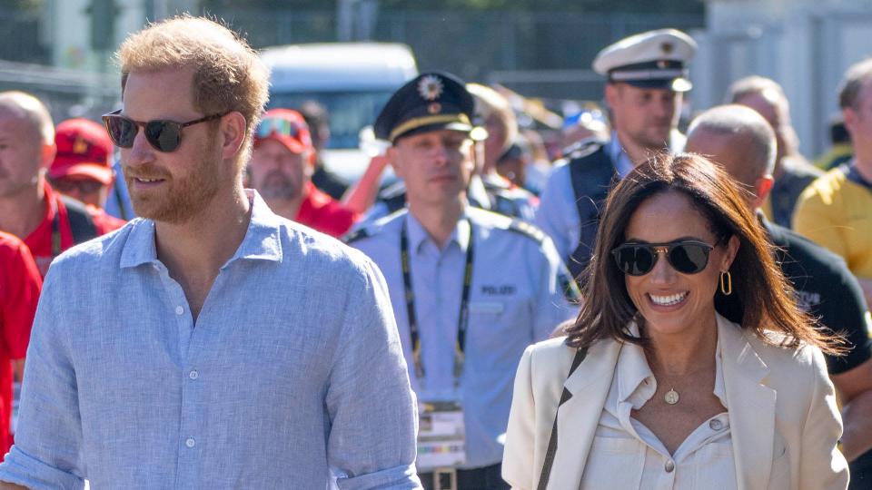 Prince Harry and Meghan markle walk hand in hand