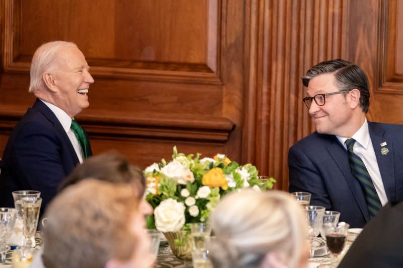 U.S. President Joe Biden shares a light moment with House Speaker Mike Johnson, R-La., during the Friends of Ireland Luncheon in Washington, D.C., on Friday. Photo by Nathan Howard/UPI