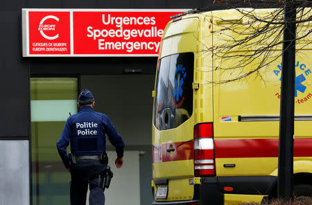 A Belgian police officer walks towards the emergency access of the Cliniques de l'Europe Sint-Elisabeth hospital where Democratic Republic of Congo's veteran opposition leader Etienne Tshisekedi died yesterday, in Brussels, Belgium, February 2, 2017. REUTERS/Francois Lenoir