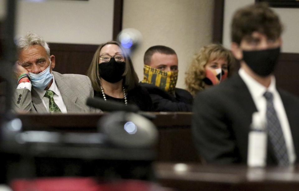 Cameron Herrin's family from left: father Chris Herrin, mother Cheryl Herrin, brother Tristan Herrin and aunt Kim Salter attend a sentencing hearing for Herrin, right, on Thursday, April 8, 2021, at the Hillsborough County Edgecomb Courthouse before 13th Judicial Circuit Court Judge Christopher Nash in downtown Tampa, Fla. Herrin was sentenced to 24 years in prison for killing an Ohio mother and her young daughter in a 2018 traffic crash. (Douglas R. Clifford/Tampa Bay Times via AP)