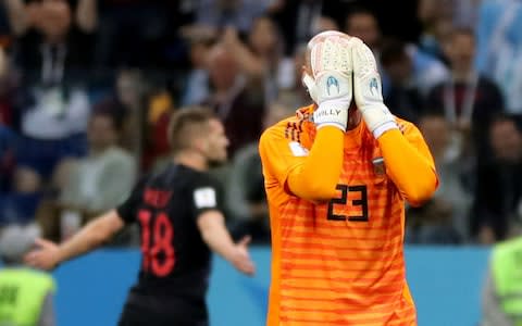 Willy Caballero holds his head in his hands after gifting Croatia their first goal - Credit: REUTERS/Ivan Alvarado