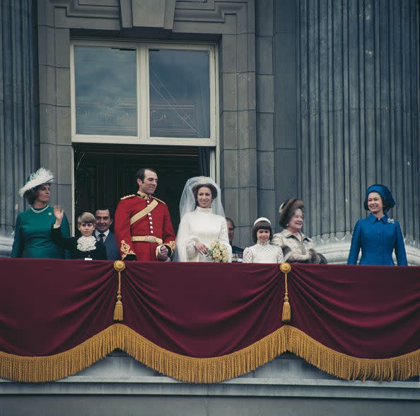 <p>Following the wedding of Princess Anne to Mark Phillips, the newlyweds made the customary appearance on the <a href="https://www.townandcountrymag.com/society/tradition/a9990351/buckingham-palace-royal-balcony-history/" rel="nofollow noopener" target="_blank" data-ylk="slk:royal balcony;elm:context_link;itc:0;sec:content-canvas" class="link ">royal balcony</a>.</p>