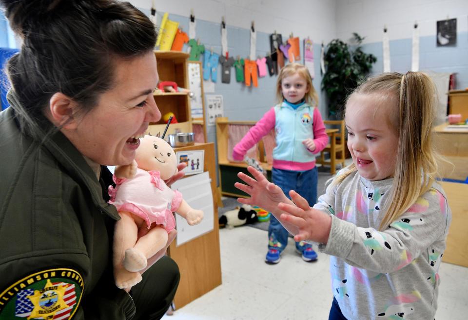 Deputy Jamie Haynes drops in to play with Claire Davis as part of her day at Franklin Elementary. Five years ago, county officials rushed to staff all elementary schools with SROs following the Sandy Hook tragedy. Tuesday Jan. 30, 2018, in Franklin, Tenn