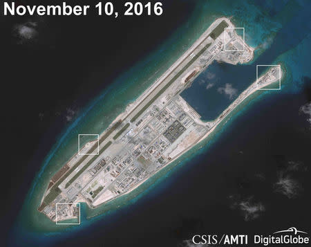 A satellite image shows what CSIS Asia Maritime Transparency Initiative says appears to be anti-aircraft guns and what are likely to be close-in weapons systems (CIWS) on the artificial island Fiery Cross Reef in the South China Sea in this image released on December 13, 2016. Courtesy CSIS Asia Maritime Transparency Initiative/DigitalGlobe/Handout via REUTERS