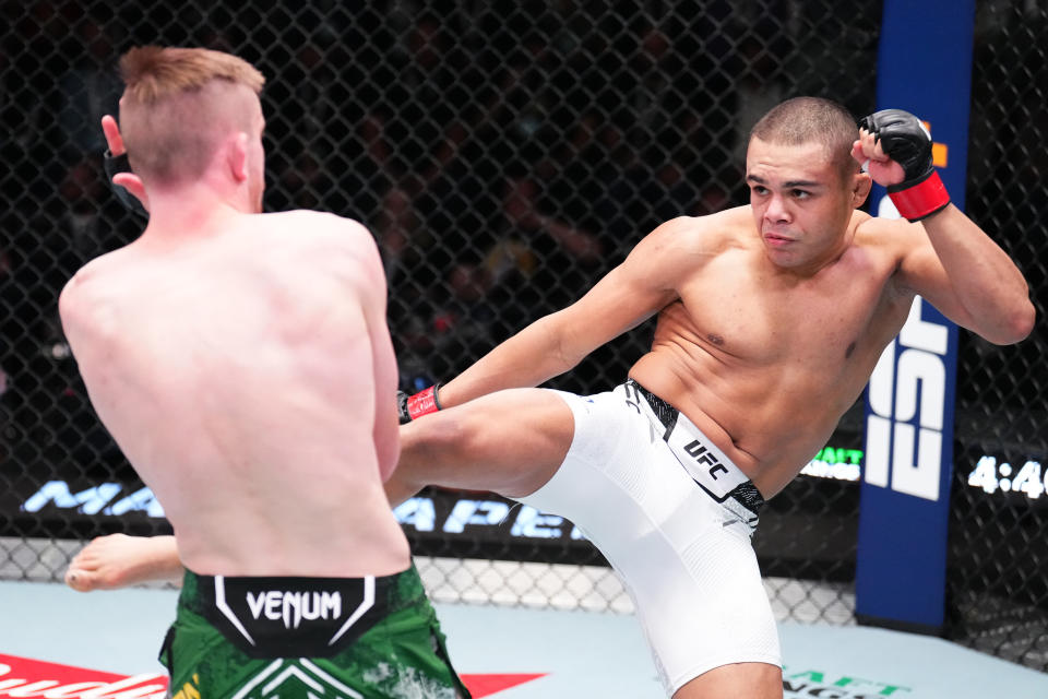 LAS VEGAS, NEVADA – JANUARY 13: (R-L) Nikolas Motta of Brazil kicks Tom Nolan of Australia in a lightweight fight during the UFC Fight Night event at UFC APEX on January 13, 2024 in Las Vegas, Nevada. (Photo by Chris Unger/Zuffa LLC via Getty Images)