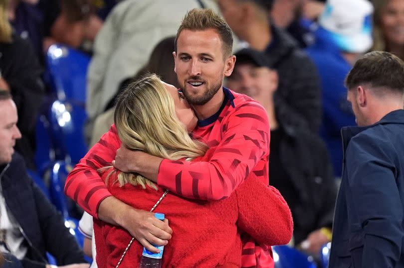 Harry Kane hugging his wife Kate after facing Serbia in the Euros