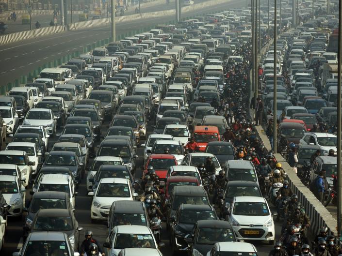A busy highway full of cars in India