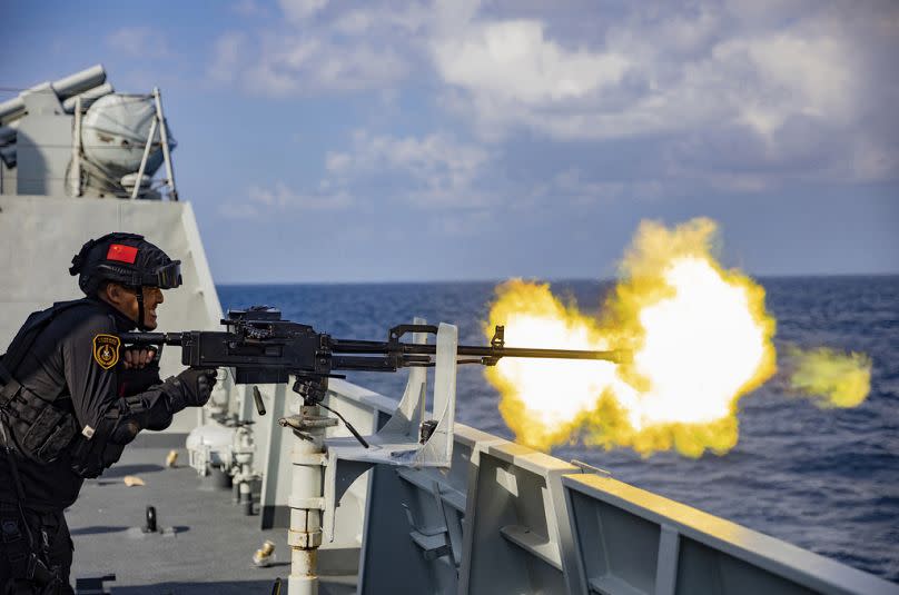 A soldier fires a weapon during a combat training of the 42nd fleet of the China's People's Liberation Army (PLA) Navy at an unspecified location, January 2023