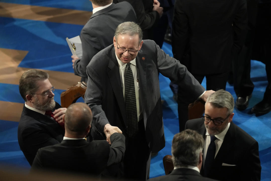 United States ambassador to Canada David L. Cohen, centre,  arrives to the funeral of former prime minister Brian Mulroney, in Montreal, Saturday, March 23, 2024. THE CANADIAN PRESS/Adrian Wyld