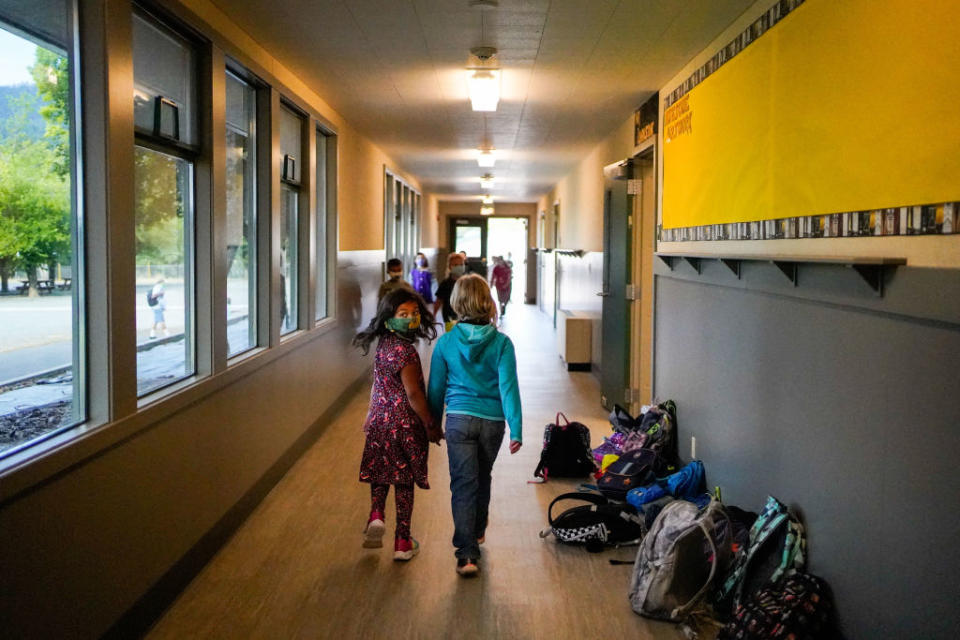 Aug. 17: Students walk to reopened class at Weaverville Elementary School on, in Weaverville, California. (Getty Images)