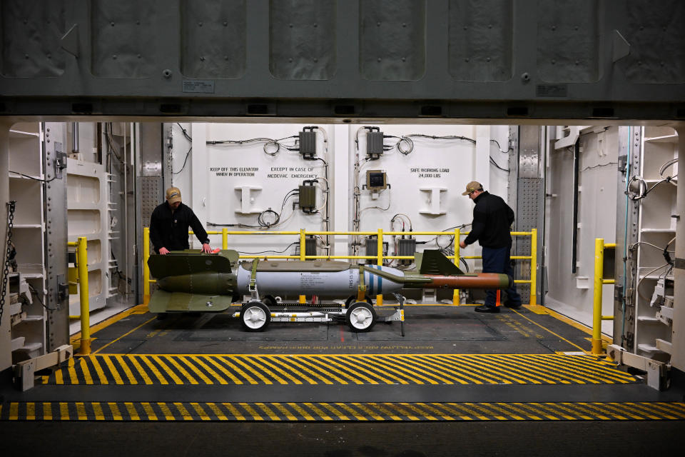 GOSPORT, ENGLAND - NOVEMBER 17: Navy personnel work in an advanced weapons elevator of USS Gerald R. Ford, on November 17, 2022 in Gosport, England. The USS Gerald R. Ford (CVN-78) is the lead ship of her class of United States Navy aircraft carriers. Commissioned in 2017, the carrier is powered by two nuclear reactors with a length of 1,092 feet and displacement of 100,000 long tons full load. With a crew of approximately 4,550, 75+ aircraft and state of the art weaponry, the first-in-class is the US Navy's most advanced aircraft carrier. USS Gerald Ford has been carrying out NATO exercises in the North Atlantic with French and Spanish ships. (Photo by Finnbarr Webster/Getty Images)