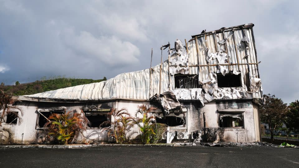 A burnt building is seen in the Normandy industrial zone in Noumea, France's Pacific territory of New Caledonia, on May 20, 2024. - Theo Rouby/AFP/Getty Images