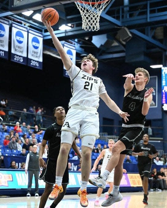 Freshman Zach Halligan walked on at the University of Akron walked on with the Zips just like his father, Dennis, walked on at Creighton. The two schools will meet Thursday in a NCAA Tournament opener.