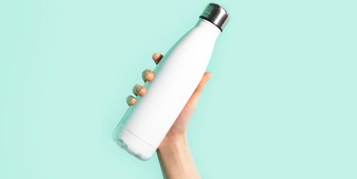 water bottle being held in the air
