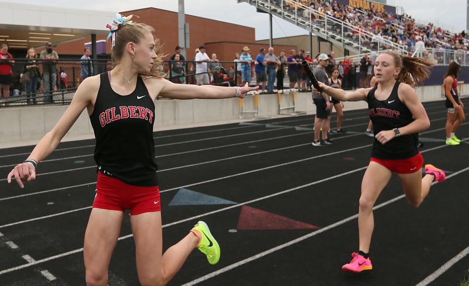 Sophomore Keira Anderson (with the baton) and junior Sarah Feddersen are both back for the Gilbert girls track and field team in 2024 after helping the Tigers win the Class 3A 4x800-meter relay at the Iowa high school state co-ed track and field meet in 2023.