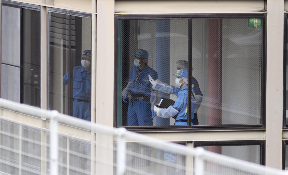 <p>Police investigators work at the Tsukui Yamayuri-en, a facility for the disabled where a number of people were killed and dozens injured in a knife attack in Sagamihara, outside Tokyo Tuesday, July 26, 2016. (AP Photo/Eugene Hoshiko)</p>