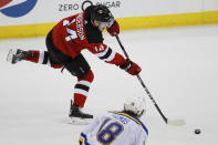 New Jersey Devils right wing Joey Anderson (14) scores on an open net during the third period of an NHL hockey game against the St. Louis Blues, Friday, March 6, 2020, in Newark. (AP Photo/John Minchillo)