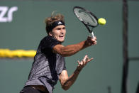 Alexander Zverev, of Germany, returns to Taylor Fritz, of the United States, at the BNP Paribas Open tennis tournament Friday, Oct. 15, 2021, in Indian Wells, Calif. (AP Photo/Mark J. Terrill)