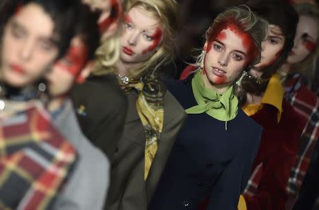 Models display creations during the Vivienne Westwood Red Label Autumn/Winter 2015 collection show at London Fashion Week in London February 22, 2015. REUTERS/Toby Melville