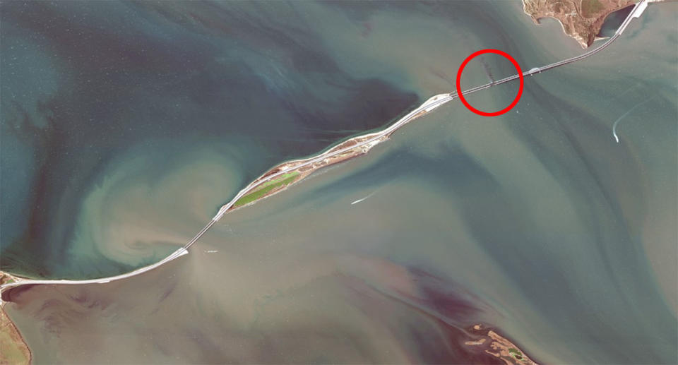 A satellite image shows where the explosion occurred on the 19km-long bridge