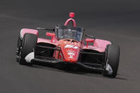Katherine Legge, of England, drives through the first turn during qualifications for the Indianapolis 500 auto race at Indianapolis Motor Speedway in Indianapolis, Saturday, May 18, 2024. (AP Photo/Michael Conroy)