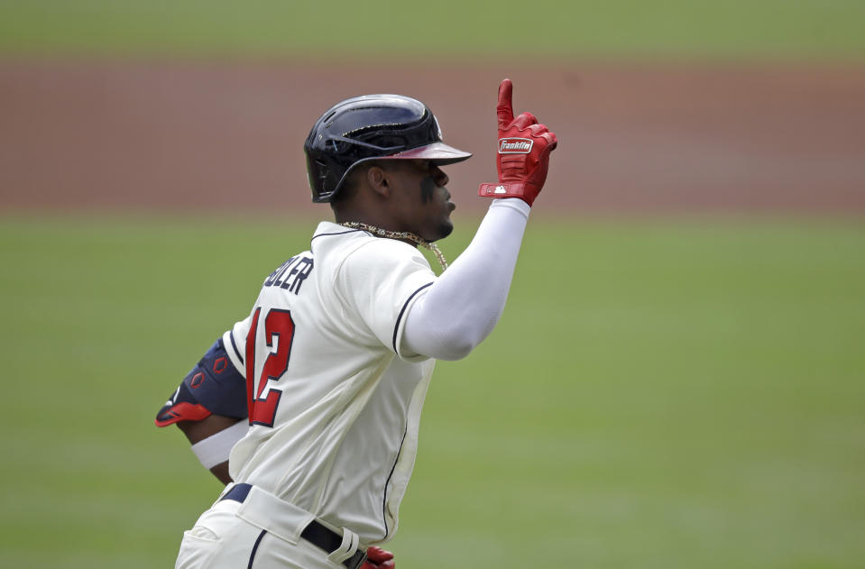 Atlanta Braves' Jorge Soler celebrates as he runs the bases after hitting a home run off New York Mets pitcher Noah Syndergaard in the first inning of a baseball game Sunday, Oct. 3, 2021, in Atlanta. (AP Photo/Ben Margot)