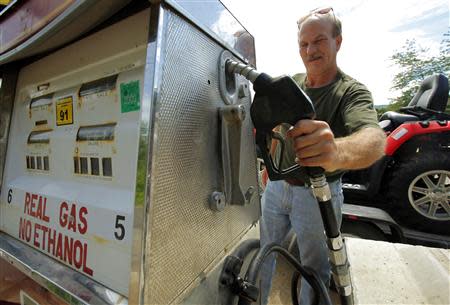 Alan Kroska refuels his ATV with "Real Gas, No Ethanol" at the Freedom Market in Freedom, New Hampshire in this July 1, 2011 file photo. REUTERS/Brian Snyder/Files