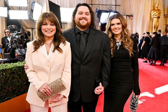 <p>Michael Buckner/Getty</p> Wolfgang Van Halen with mom Valerie Bertinelli and wife Andraia Allsop at the 2024 Oscars