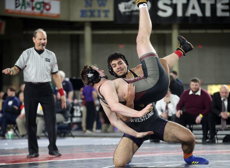 North Kitsap’s Sofian Hammou takes first place over WF West’s Andrew Penland for the 2A 220-pound championship bout during Mat Classic Championships at the Tacoma Dome on Saturday, Feb. 18, 2023. 