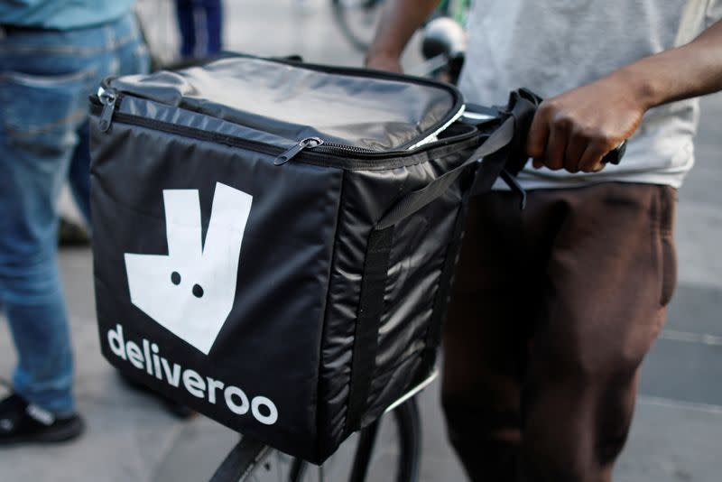 FILE PHOTO: A biker, wearing a Deliveroo food courier backpack, demonstrates during a call on clients to boycott the brand in Paris