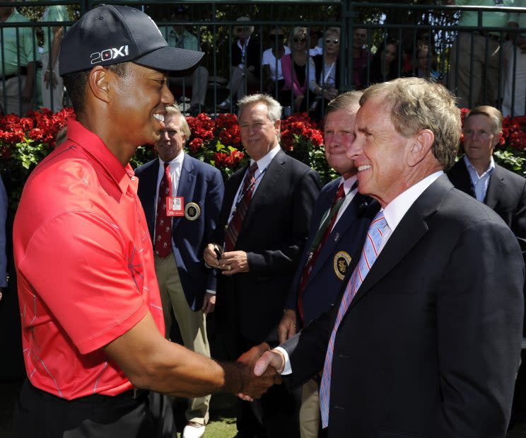 Tiger Woods and PGA Tour commissioner Tim Finchem shaking hands. (PGA Tour/Getty Images)