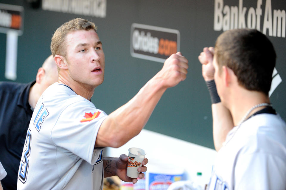 BALTIMORE, MD - AUGUST 05: Brett Lawrie #13 of the Toronto Blue Jays celebrates with teammates after hitting an RBI single in the second inning of his major league debut against the Baltimore Orioles at Oriole Park at Camden Yards on August 5, 2011 in Baltimore, Maryland. (Photo by Greg Fiume/Getty Images)