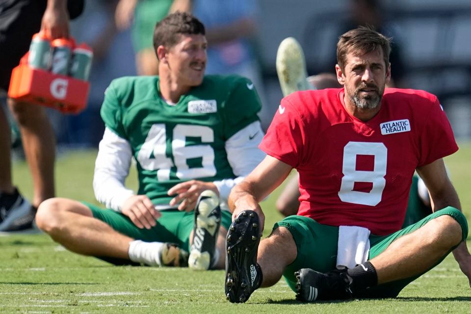 New York Jets quarterback Aaron Rodgers (8) warms up during a joint NFL football camp with the Carolina Panthers Wednesday, Aug. 9, 2023, in Spartanburg, S.C. (AP Photo/Mike Stewart)