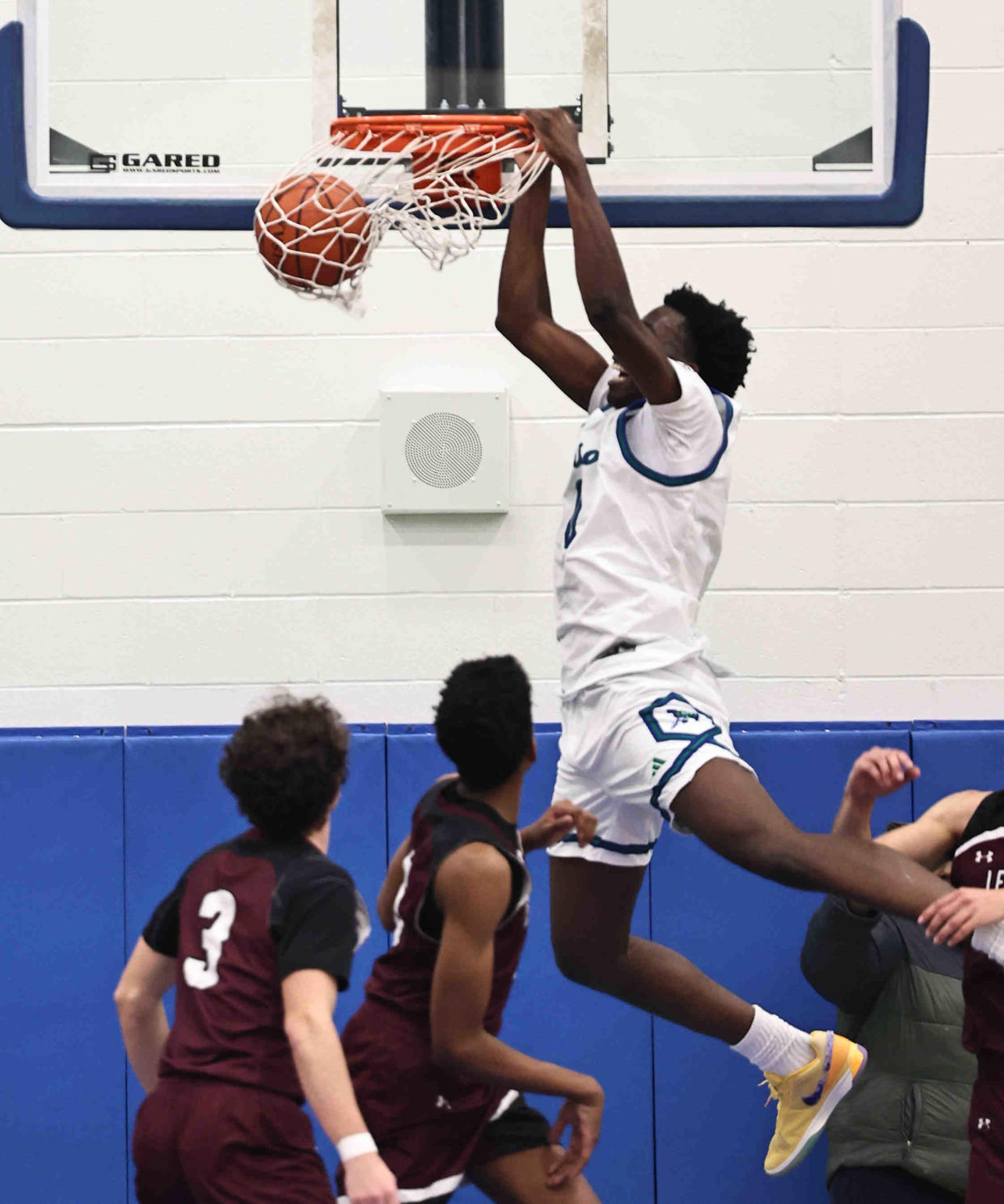 Winton Woods forward Tyler McKinley (0) goes up for a dunk past Lebanon's Quinten Wagers (24) during their 61-50 win Friday, Jan. 5, 2024.