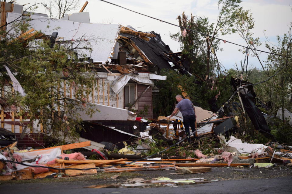 <p>People collect personal effects from damaged homes following a tornado in Dunrobin, Ontario west of Ottawa on Friday, Sept. 21, 2018. A tornado damaged cars in Gatineau, Que., and houses in a community west of Ottawa on Friday afternoon as much of southern Ontario saw severe thunderstorms and high wind gusts, Environment Canada said. (Photo from Sean Kilpatrick/The Canadian Press) </p>