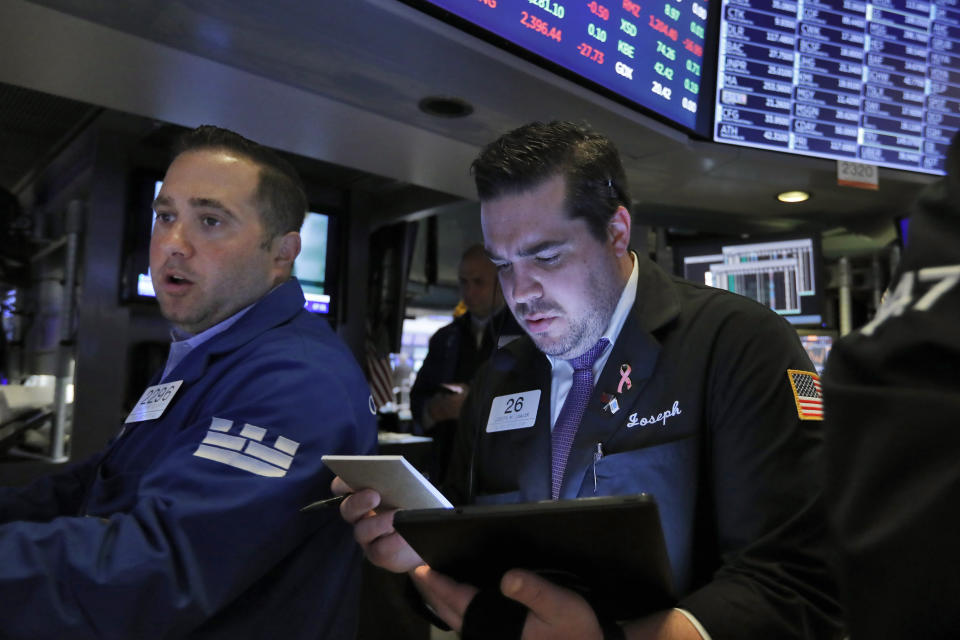 Specialist Gennaro Saporito, left, and trader Joseph Lawler work on the floor of the New York Stock Exchange, Thursday, May 30, 2019. Stocks are edging higher in early trading on Wall Street following two days of losses. (AP Photo/Richard Drew)