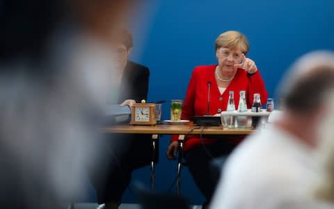 Merkel - Credit: &nbsp;Markus Schreiber/AP