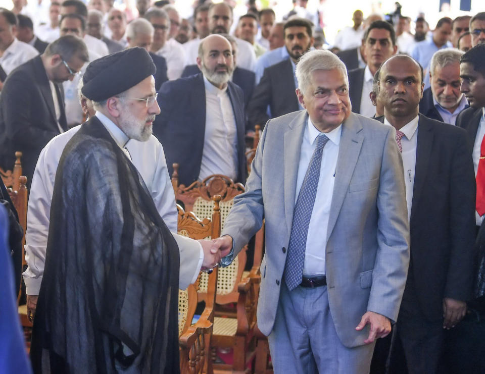 Iranian President Ebrahim Raisi, left, and Sri Lankan President Ranil Wickremesinghe shake hands at the inauguration of the Uma Oya Multipurpose Development Project in Uma Oya, about 180km (112miles) east of Colombo, Sri Lanka, Wednesday, April 24, 2024. The project was scheduled for completion in 2015 but was delayed by the sanctions, technical issues and the COVID-19 pandemic, the Sri Lankan government said. (Sri Lanka President's Office via AP)