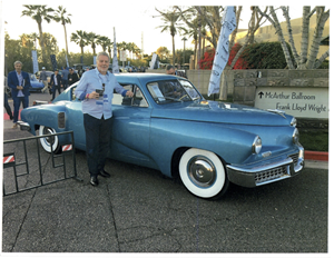 Stephen Tebo poses with the Tucker 48, commonly referred to as the Tucker Torpedo. The vehicle is one of only 47 in existence and on display at Tebo’s Garage.