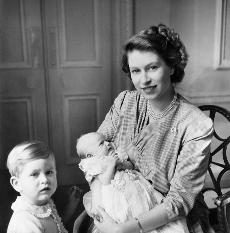 <p>Princess Elizabeth with her two children, Princess Anne and Prince Charles (PA Archive) </p>