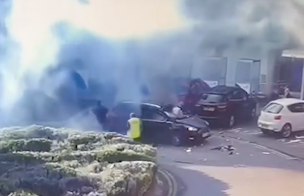 David Perry, in black top, runs from his taxi after the explosion. (Reach)