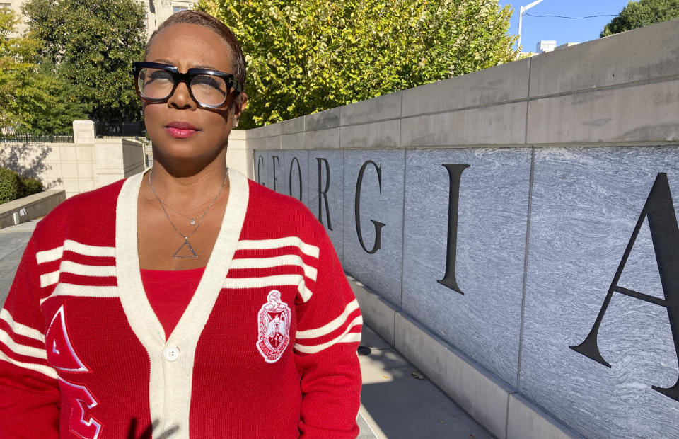 Rhonda Briggins, former co-chair of the Delta Sigma Theta National Social Action Commission and member of the sorority's Decatur alumnae chapter, poses for a photo in Atlanta, Oct. 14, 2022, in Atlanta. Briggins spent the 2020 election at an Atlanta polling place handing out water and snacks to encourage voters to stay in an hours-long line to cast their ballot, something her historic Black sorority has done for decades in Georgia. (AP Photo/Sudhin Thanawala)